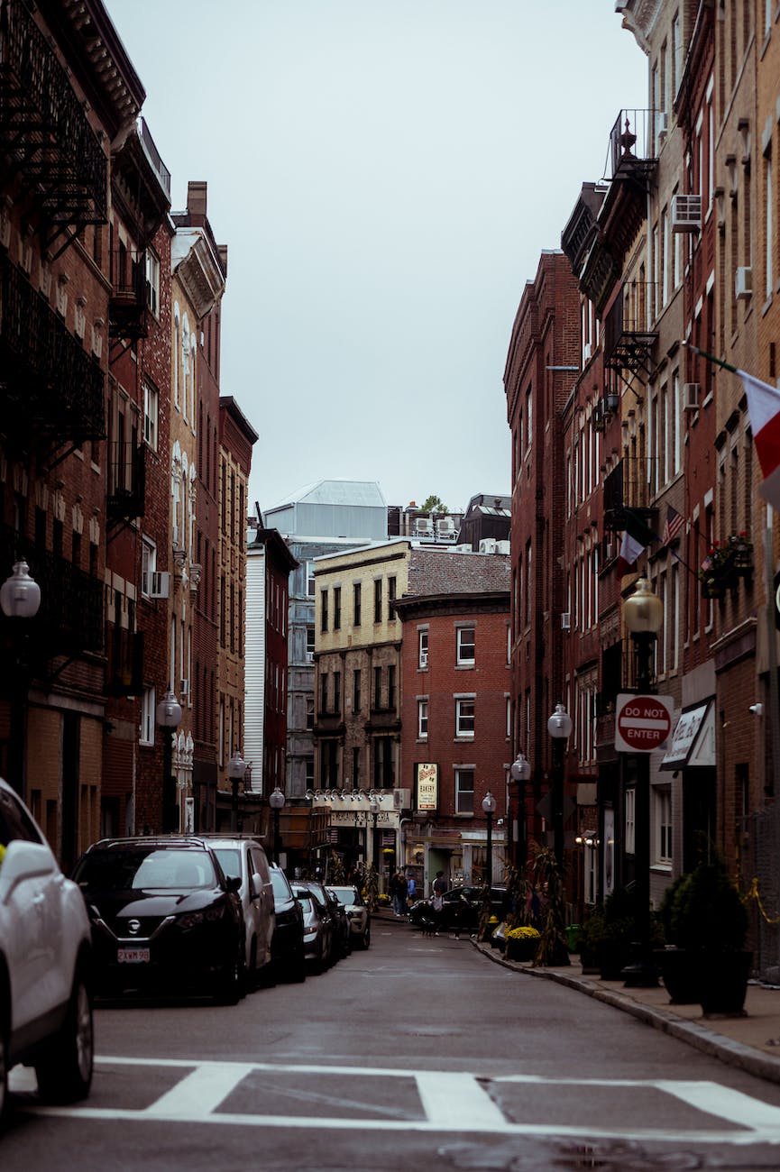 old red brick houses on a narrow street in boston north end usa